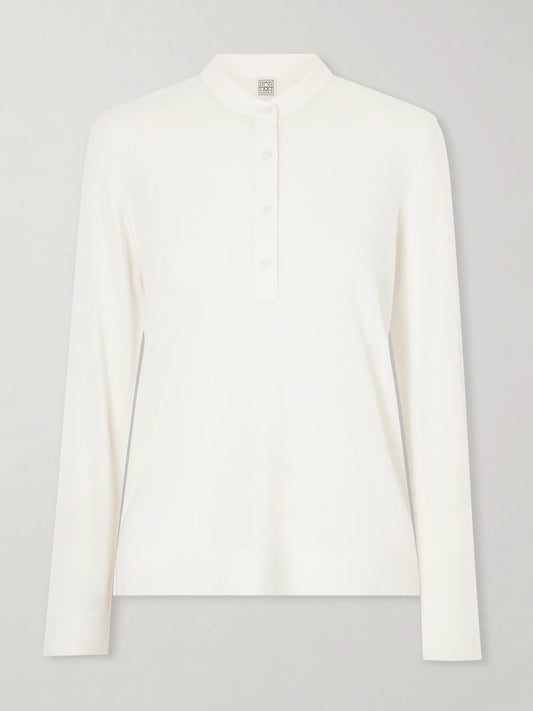 Image of a model wearing Outerwear. Product name - Wool And Silk-blend Sweater in Off-white colour by brand - TOTEME