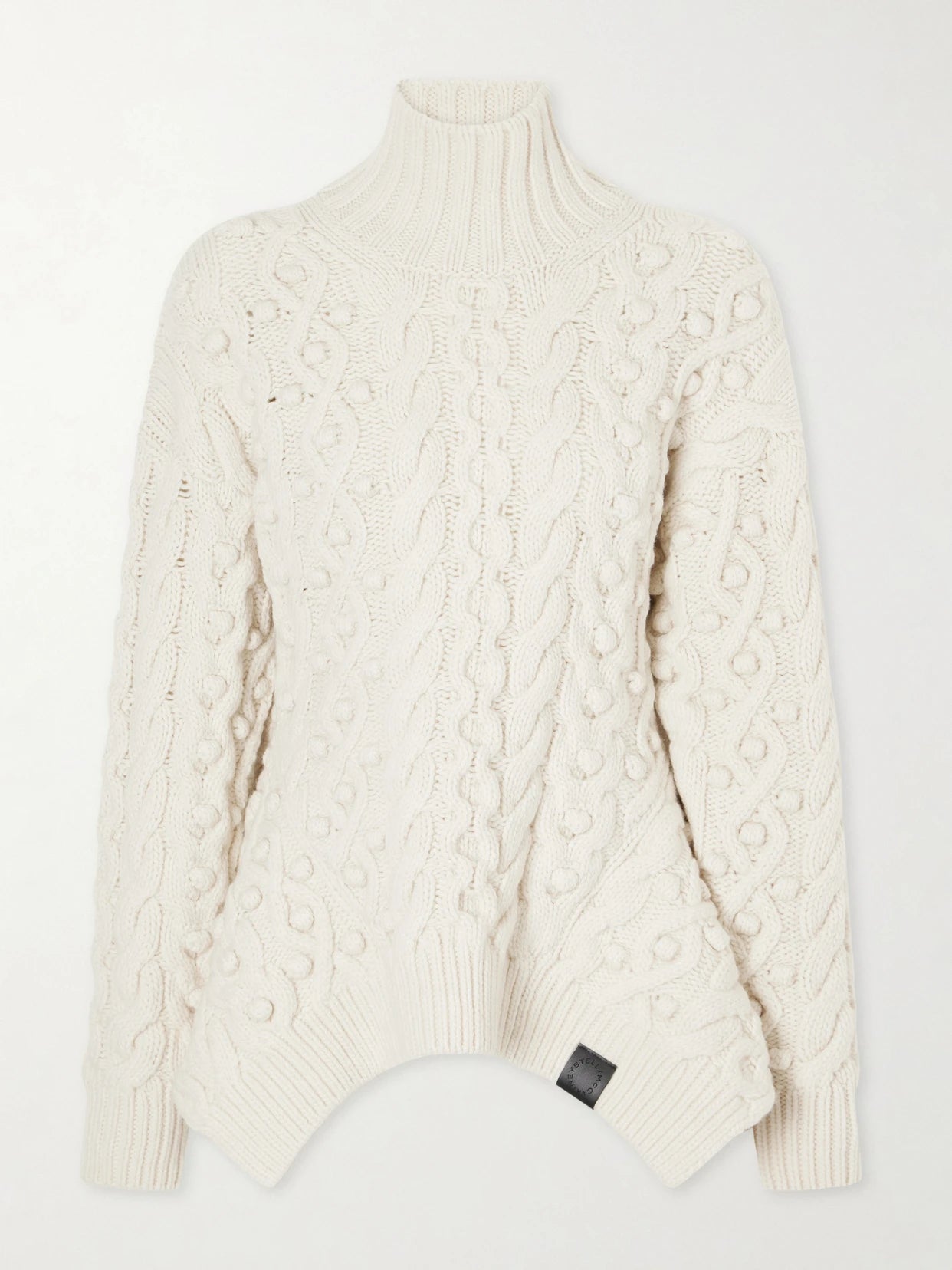 Image of a model wearing Outerwear. Product name - Bobble Cable-knit Wool Turtleneck Sweater in Ivory colour by brand - Stella McCartney