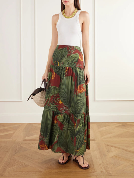 Image of a model wearing Skirts. Product name - Territorio Atemporal Tiered Printed Cotton-voile Maxi Skirt in Multi colour by brand - Johanna Ortiz