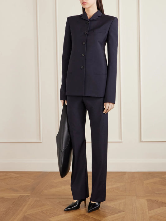Image of a model wearing Outerwear. Product name - Celton Wool Blazer in Navy colour by brand - KHAITE