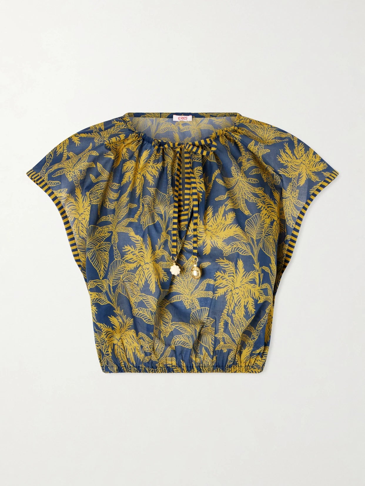 Image of a model wearing Tops. Product name - Crocodile Embellished Printed Cotton-voile Blouse in Navy colour by brand - Eres