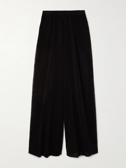 Image of a model wearing Pants. Product name - Linen And Silk-blend Wide-leg Pants in Black colour by brand - Alaïa