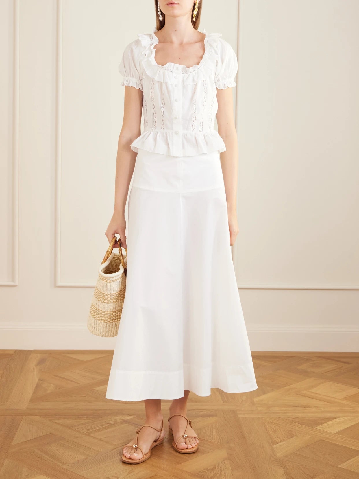 Image of a model wearing Tops. Product name - Terracina Ruffled Lace-trimmed Cotton-poplin Blouse in Off-white colour by brand - Loretta Caponi
