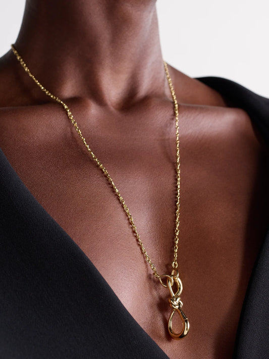 Image of Necklaces. Product name - Small True Lover's Knot Lock + Chain 18-karat Gold Necklace in Multi colour by brand - Marla Aaron