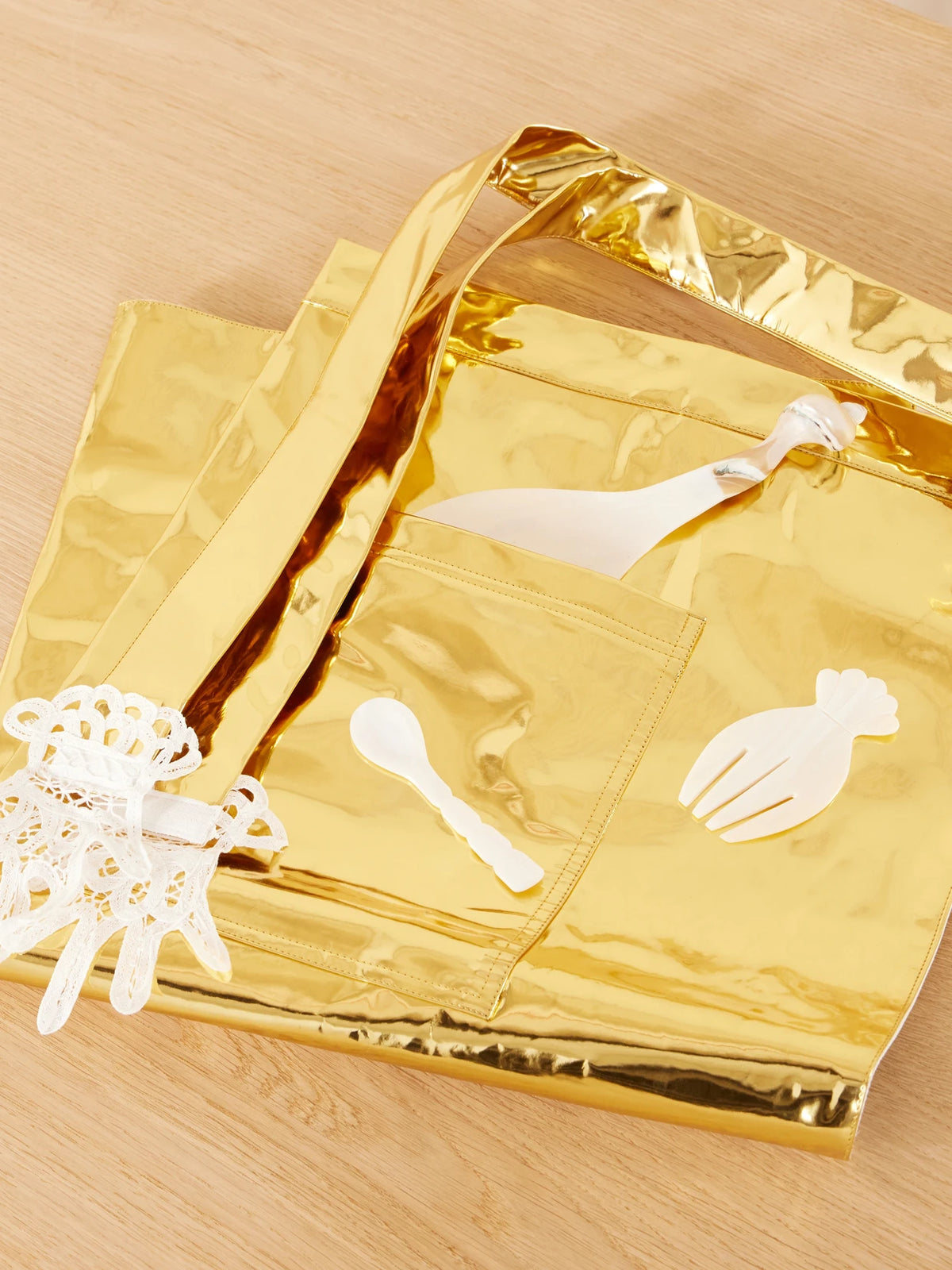 Image of Decor. Product name - Lace-trimmed Metallic Pvc Apron in Gold colour by brand - Gohar World