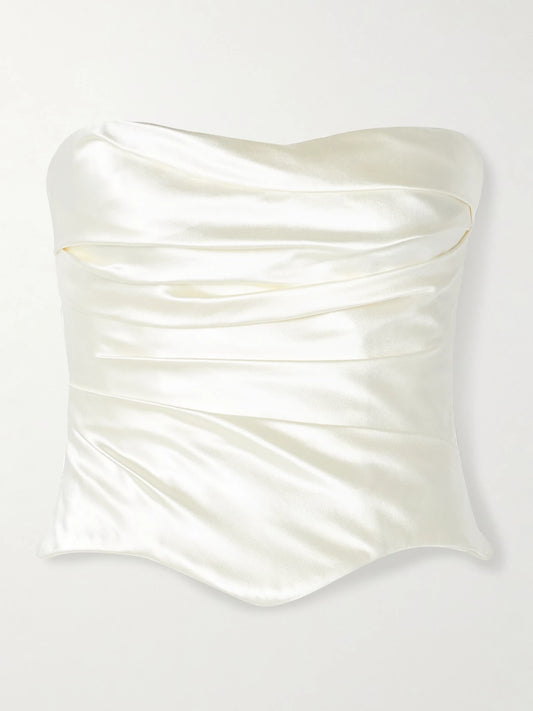 Image of a model wearing Tops. Product name - Demi Strapless Draped Silk And Wool-blend Satin Bustier Top in Off-white colour by brand - Danielle Frankel