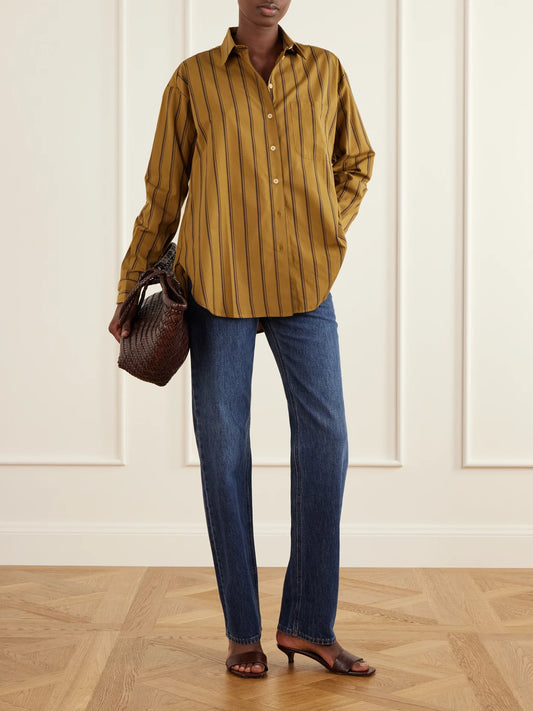 Image of a model wearing Tops. Product name - The Essential Striped Cotton And Silk-blend Shirt in Brown colour by brand - Jamie Haller