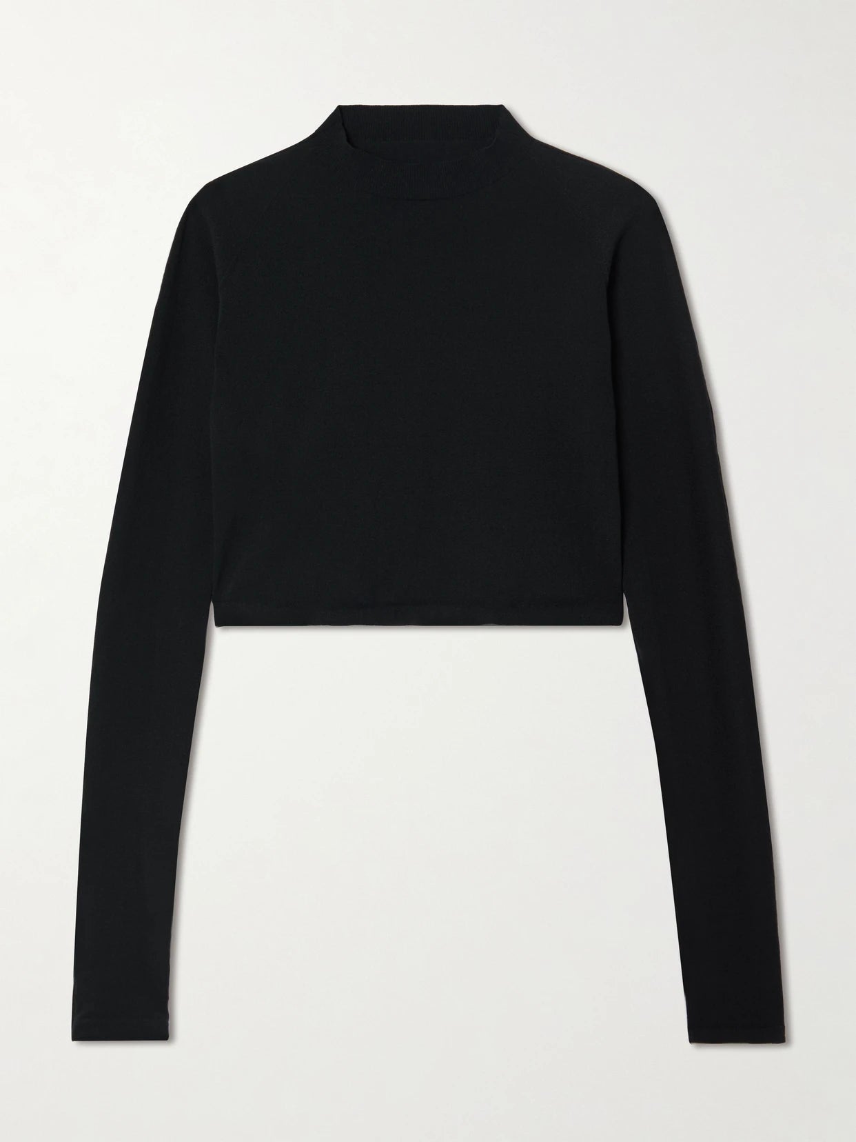 Image of a model wearing Tops. Product name - Paneled Cropped Jersey Top in Black colour by brand - Alaïa