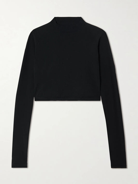 Image of a model wearing Tops. Product name - Paneled Cropped Jersey Top in Black colour by brand - Alaïa