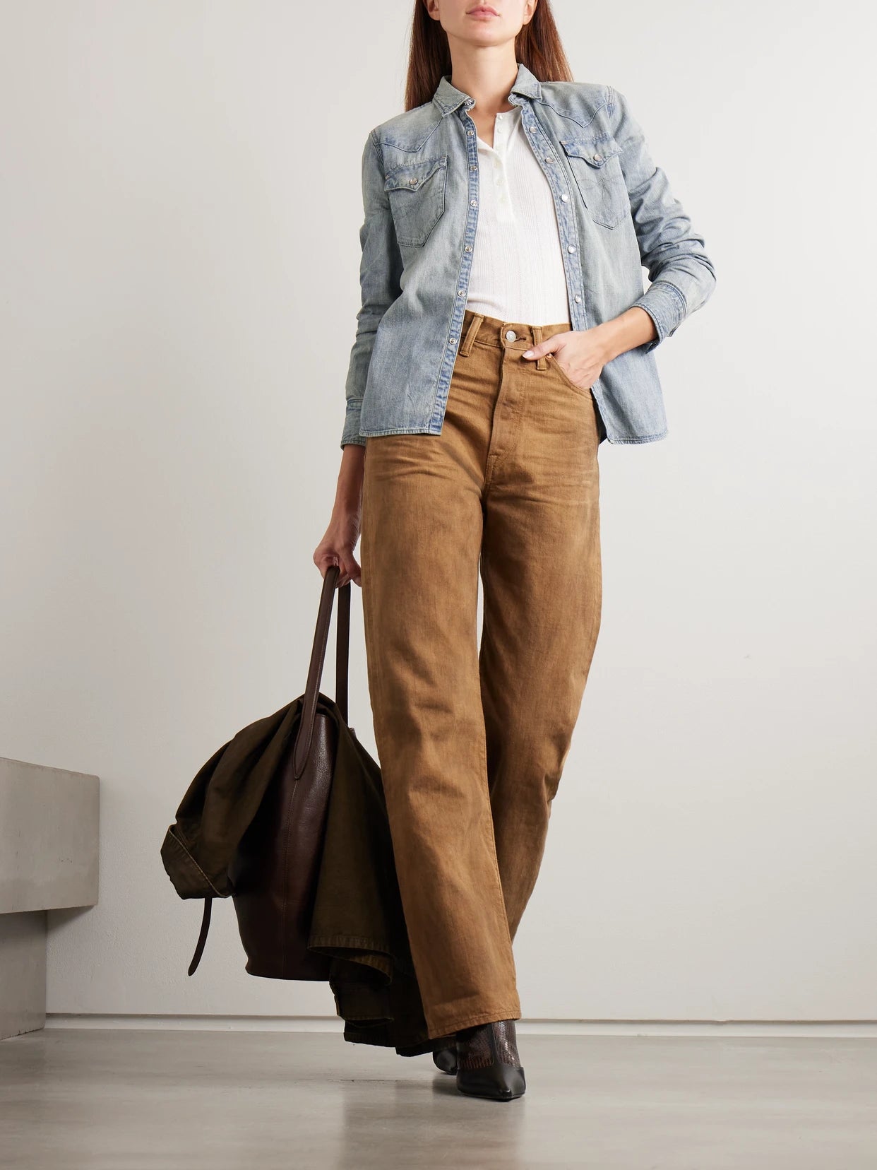 Image of a model wearing Tops. Product name - Buffalo Denim Shirt in Light denim colour by brand - RRL