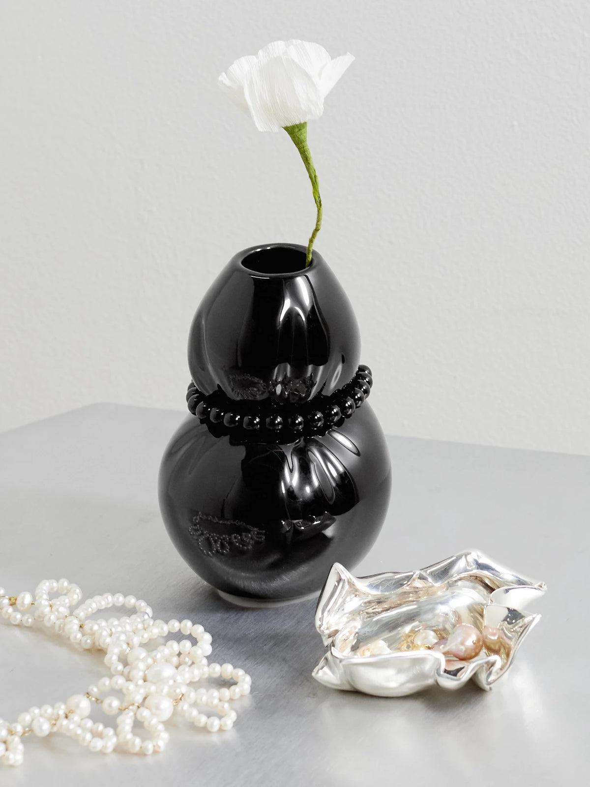 Image of Decor. Product name - Squeezed Pearl-like Embellished Glazed Ceramic Vase in Black colour by brand - Completedworks