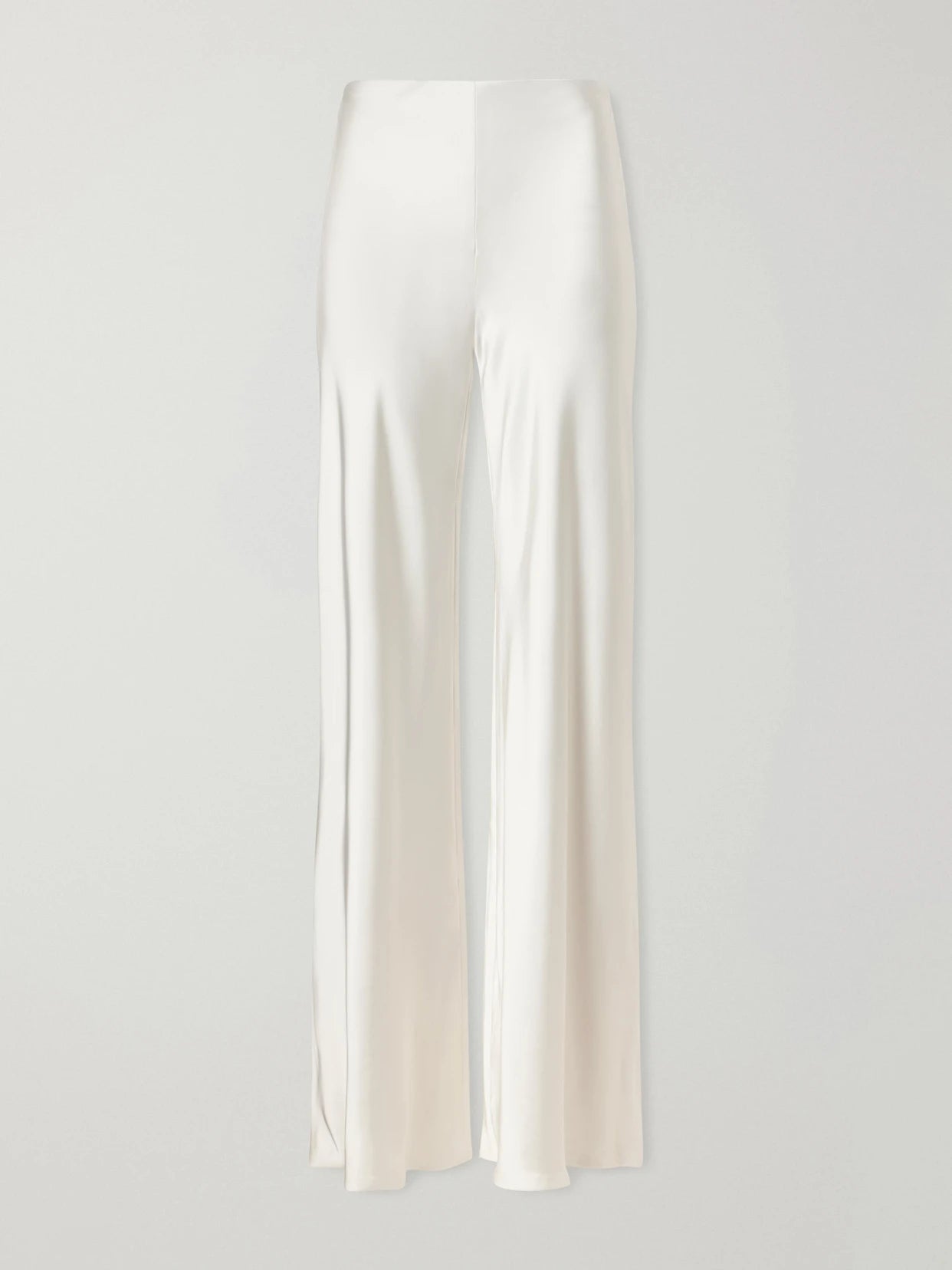 Image of a model wearing Pants. Product name - Satin High-rise Wide-leg Pants in White colour by brand - Norma Kamali