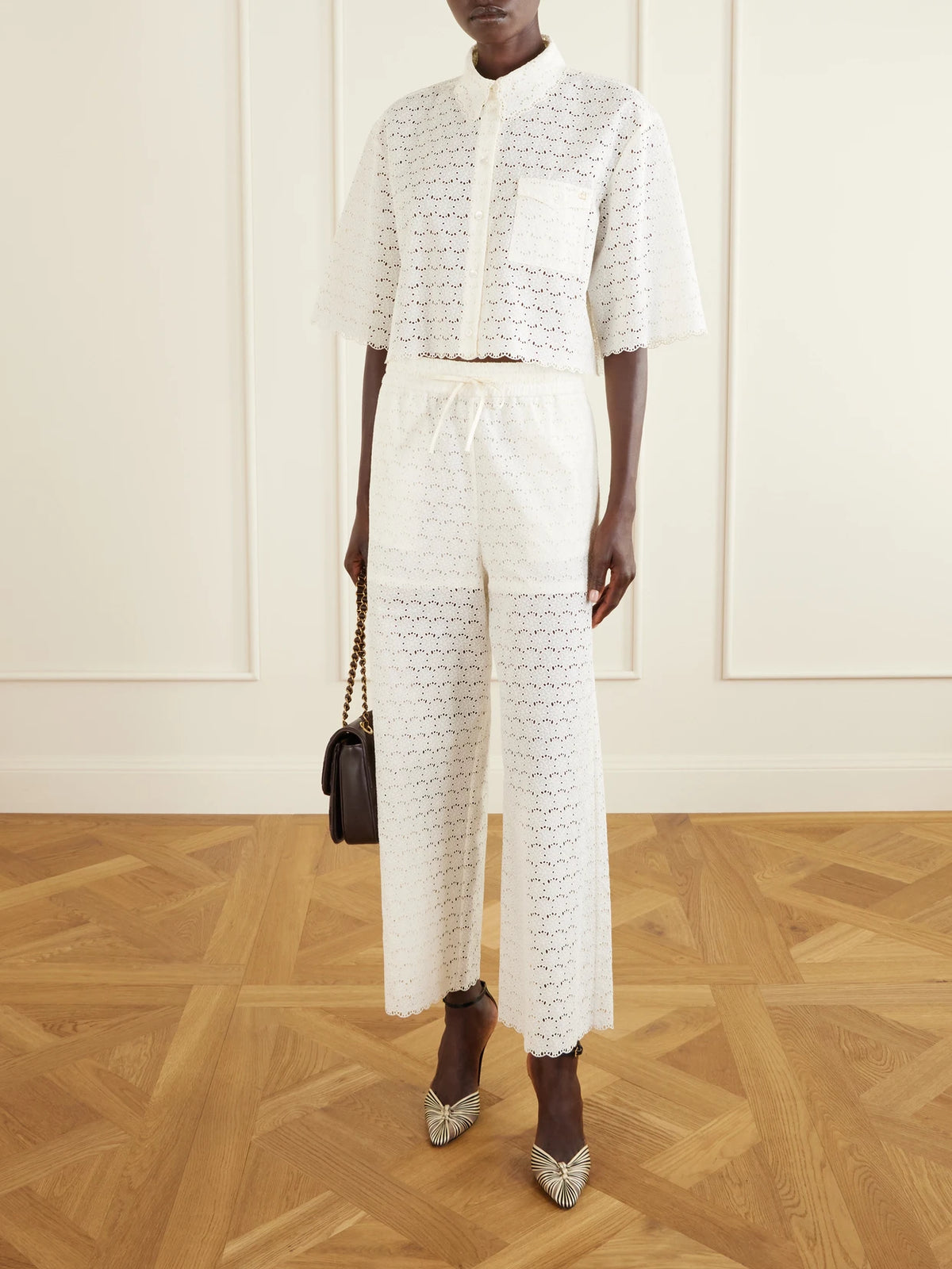 Image of Blouses. Product name - Mossi Logo-embellished Cropped Broderie Anglaise Cotton Blouse in Ivory colour by brand - Valentino Garavani