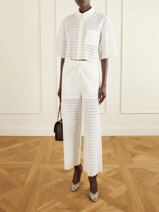 Image of Blouses. Product name - Mossi Logo-embellished Cropped Broderie Anglaise Cotton Blouse in Ivory colour by brand - Valentino Garavani