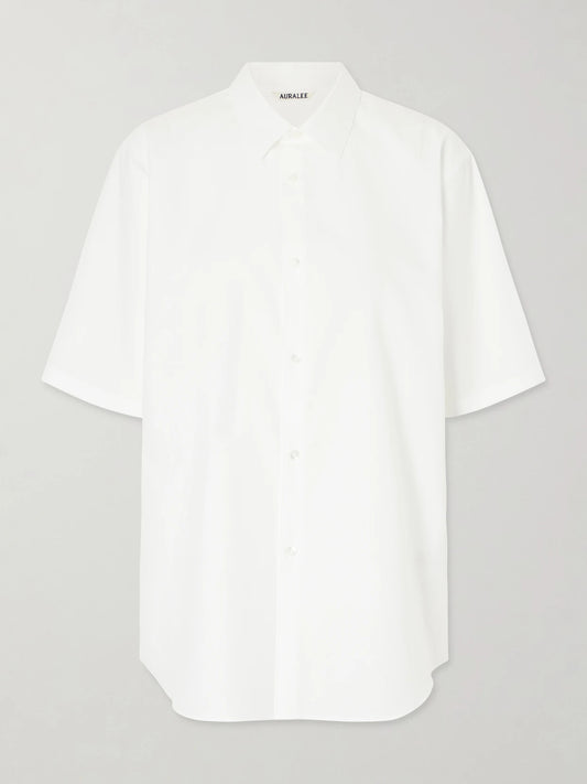 Image of a model wearing Tops. Product name - Cotton-poplin Shirt in White colour by brand - Auralee
