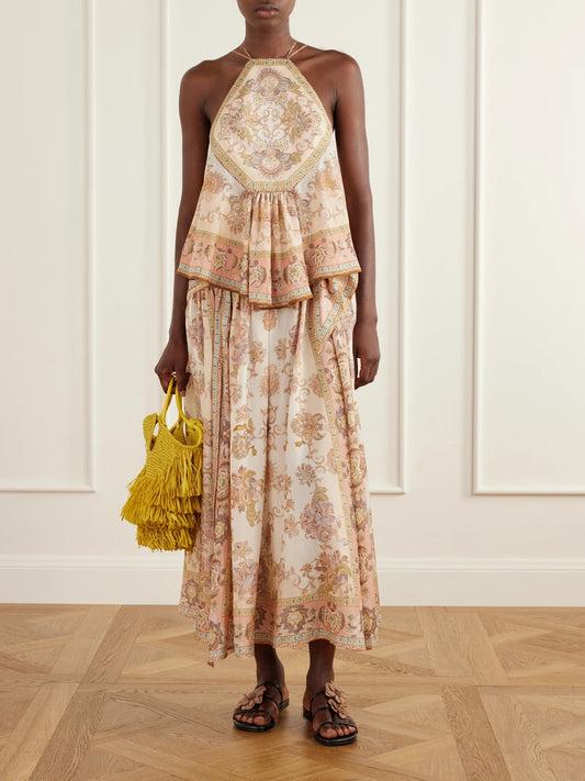 Image of a model wearing Skirts. Product name - Echo Scarf-detailed Printed Silk Midi Skirt in Cream colour by brand - Zimmermann