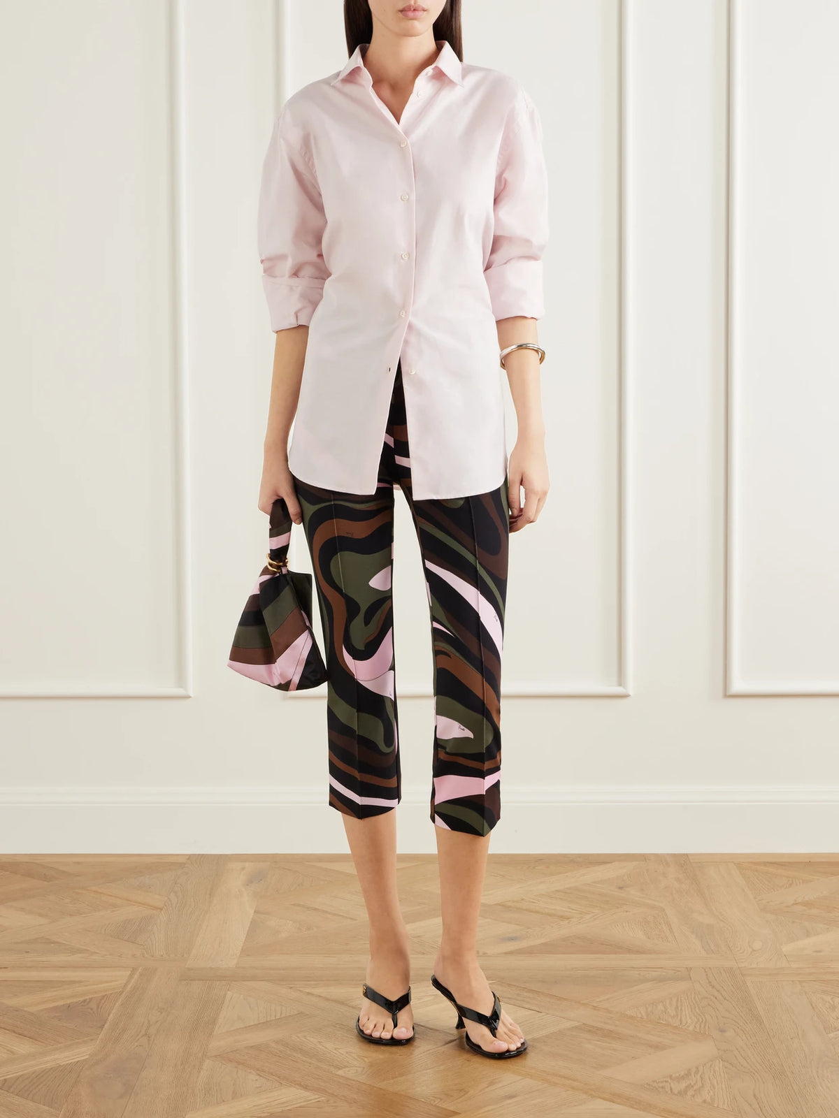 Image of a model wearing Pants. Product name - Cropped Printed Jersey Skinny-leg Pants in Multi colour by brand - PUCCI