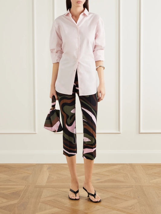 Image of a model wearing Pants. Product name - Cropped Printed Jersey Skinny-leg Pants in Multi colour by brand - PUCCI