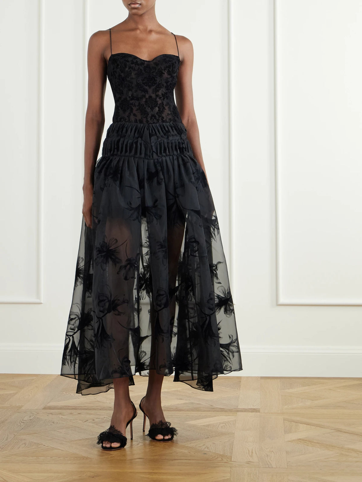 Image of a model wearing Skirts. Product name - Rebecca Velvet-trimmed Organza Midi Skirt in Black colour by brand - Pauline Dujancourt