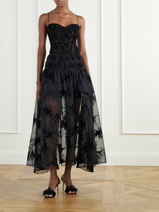 Image of a model wearing Skirts. Product name - Rebecca Velvet-trimmed Organza Midi Skirt in Black colour by brand - Pauline Dujancourt