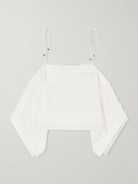 Image of a model wearing Tops. Product name - Embroidered Ramie Top in White colour by brand - Self-Portrait