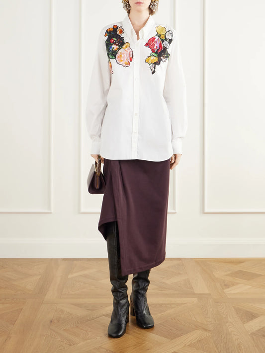 Image of a model wearing Tops. Product name - Floral-embroidered Cotton-poplin Shirt in White colour by brand - Dries Van Noten