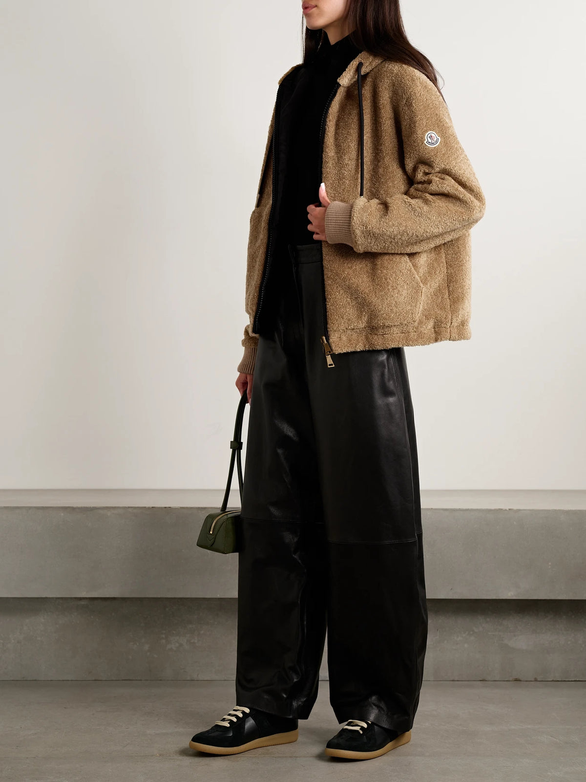 Image of a model wearing Outerwear. Product name - Reversible Fleece And Shell Zip-up Hoodie in Brown colour by brand - Moncler