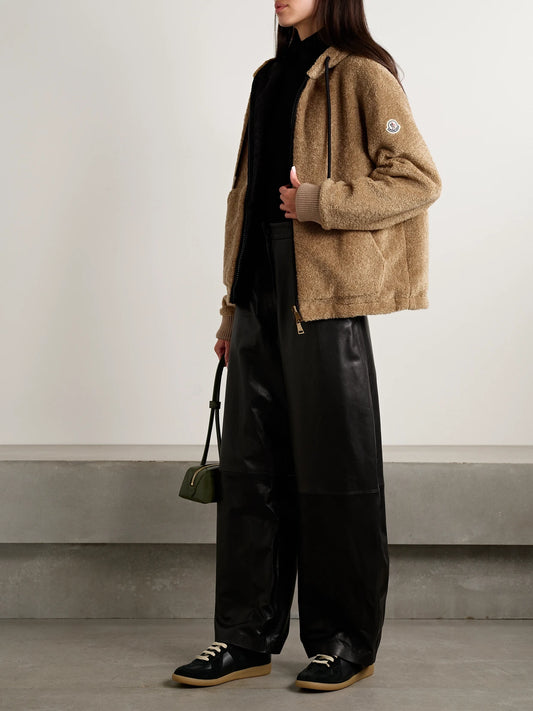 Image of a model wearing Outerwear. Product name - Reversible Fleece And Shell Zip-up Hoodie in Brown colour by brand - Moncler
