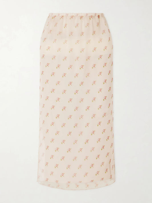 Image of a model wearing Skirts. Product name - Sydni Floral-print Silk-organza Midi Skirt in Pastel pink colour by brand - KHAITE