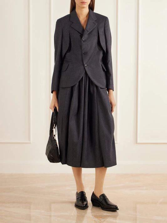 Image of a model wearing Skirts. Product name - Paneled Wool-twill Midi Skirt in Charcoal colour by brand - Comme des Garçons Comme des Garçons
