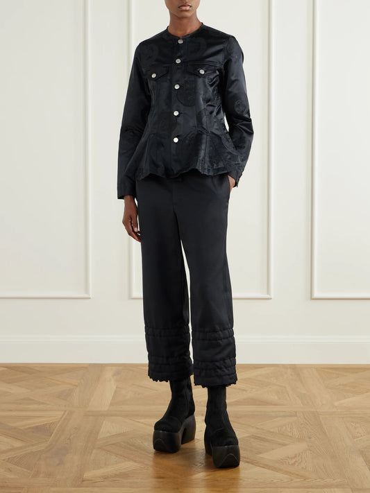 Image of a model wearing Pants. Product name - Ruffled-trimmed Twill Wide-leg Pants in Black colour by brand - Comme des Garçons Comme des Garçons