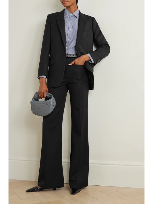 Image of a model wearing Outerwear. Product name - Diane Stretch-wool Twill Blazer in Black colour by brand - Nili Lotan