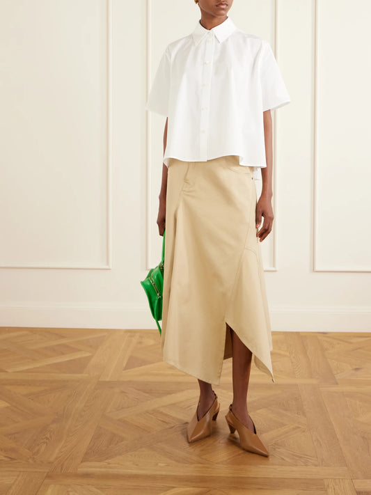 Image of a model wearing Tops. Product name - Logo-embroidered Cotton-poplin Shirt in White colour by brand - LOEWE