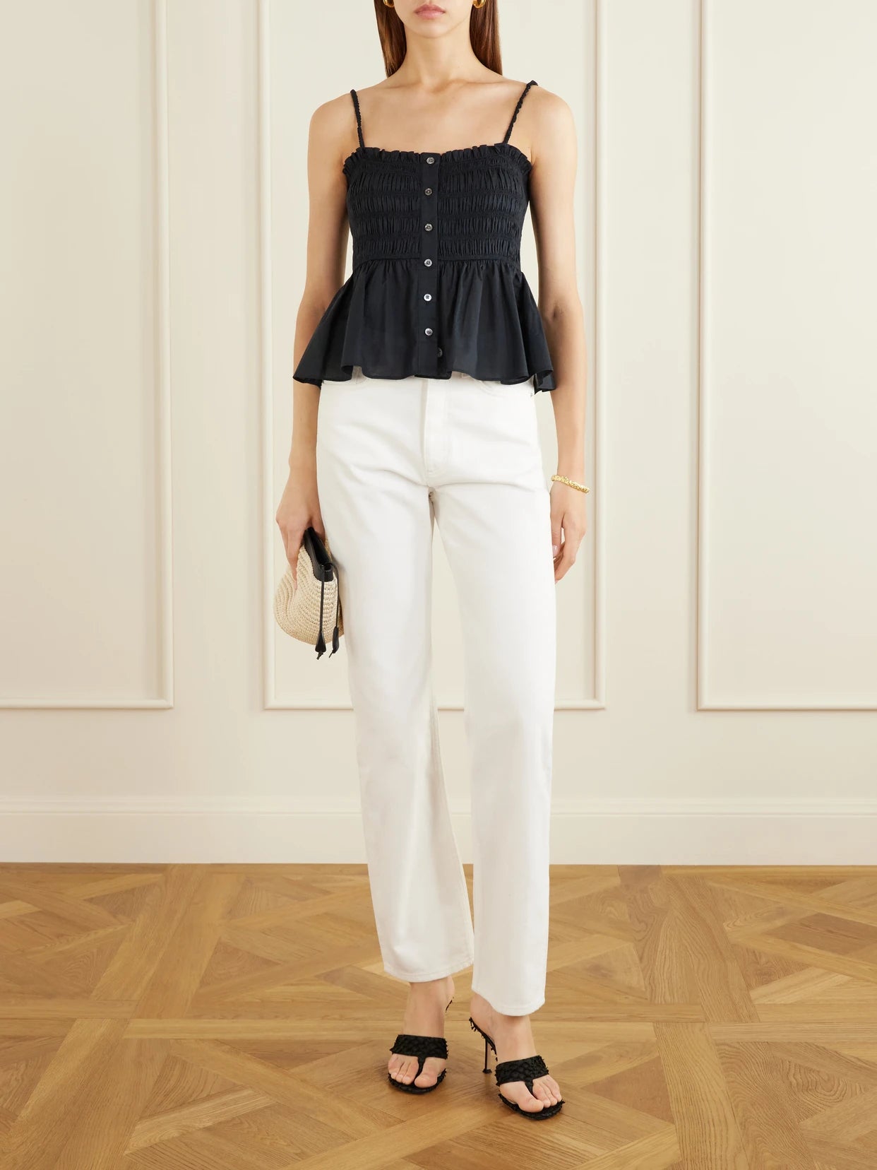 Image of a model wearing Tops. Product name - Tullia Shirred Tiered Cotton-poplin Top in Black colour by brand - Veronica Beard