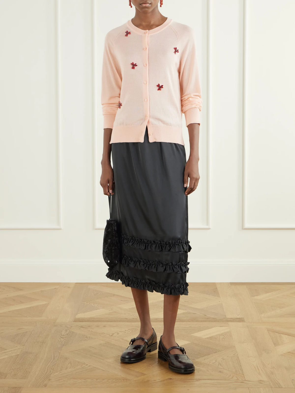 Image of a model wearing Outerwear. Product name - Crystal-embellished Wool And Silk-blend Cardigan in Pink colour by brand - Simone Rocha