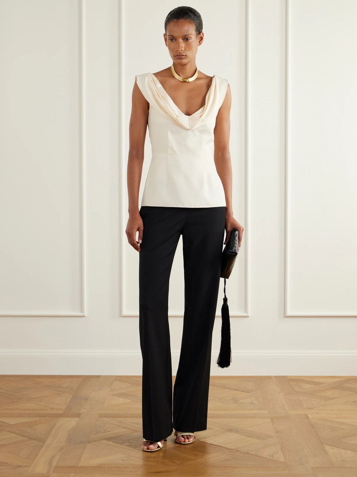 Image of a model wearing Tops. Product name - Draped Silk-poplin Blouse in Ivory colour by brand - Colleen Allen