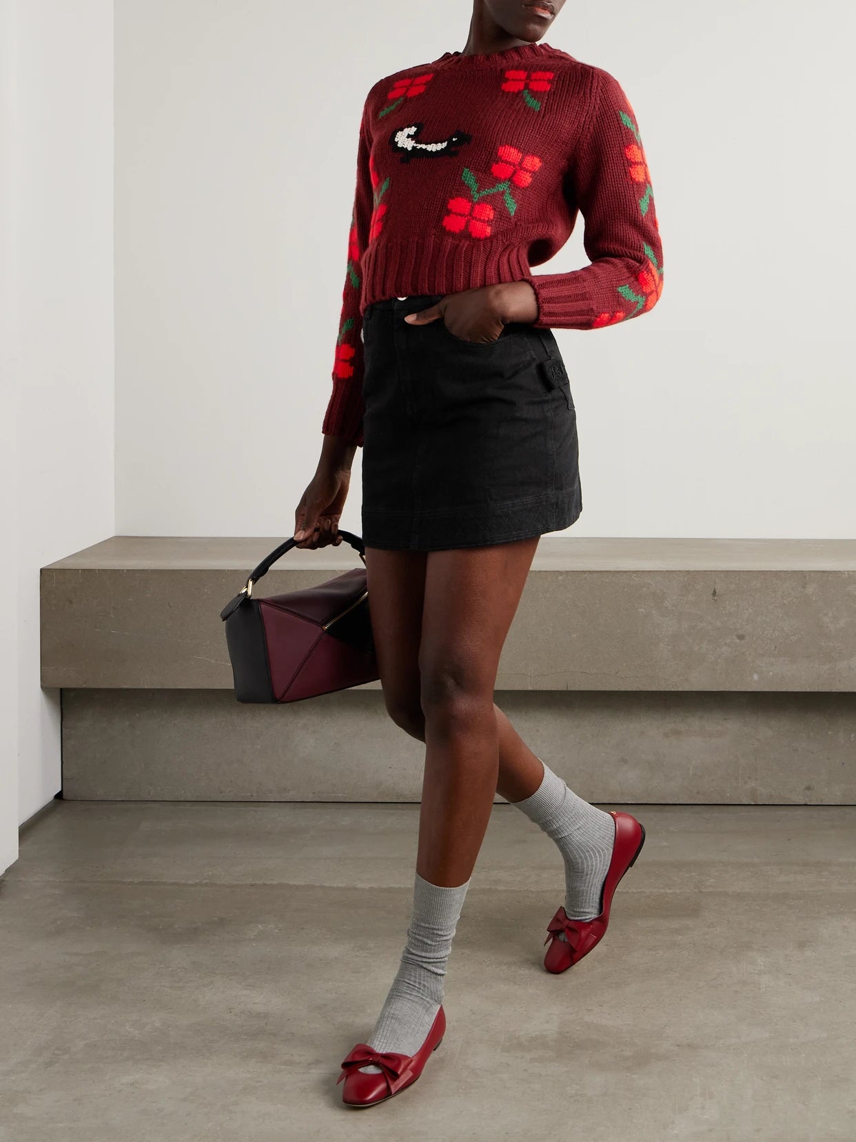Image of a model wearing Outerwear. Product name - Intarsia-knit Wool Sweater in Red colour by brand - BODE