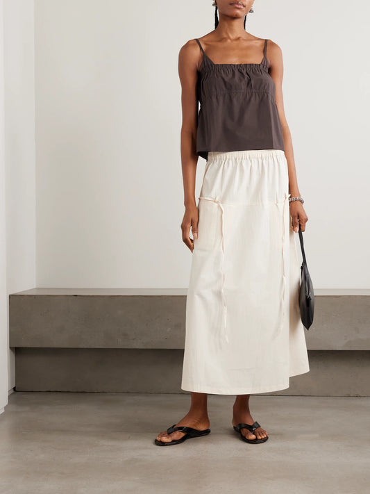 Image of a model wearing Tops. Product name - Tri Frayed Organic Cotton Camisole in Brown colour by brand - Deiji Studios