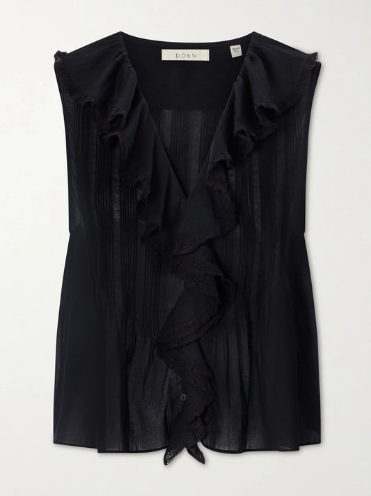 Image of a model wearing Tops. Product name - Hilda Ruffled Embroidered Organic Cotton Top in Black colour by brand - DÔEN