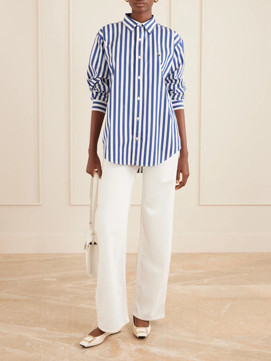 Image of a model wearing Tops. Product name - Striped Cotton-poplin Shirt in Navy colour by brand - Aimé Leon Dore