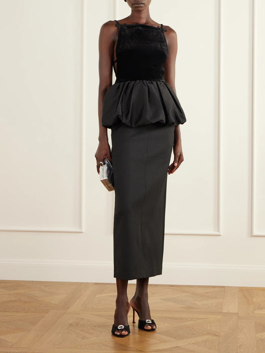 Image of a model wearing Tops. Product name - Bow-detailed Peplum Satin-trimmed Velvet Top in Black colour by brand - Self-Portrait