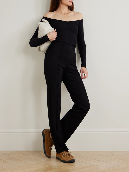 Image of Sleepwear & Loungewear. Product name - Baselayers Mid-rise Cropped Kick Flare Pants - Obsidian in Black colour by brand - SKIMS
