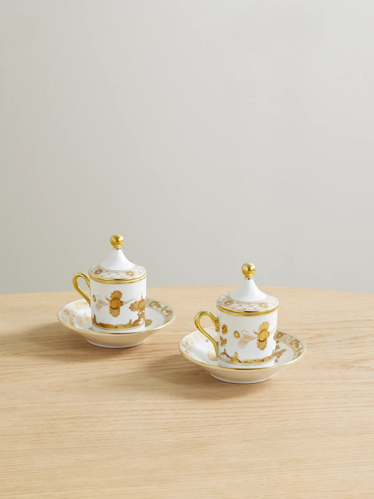 Oriente Italiano Set Of Two Gold-plated Porcelain Coffee Cups, Covers And Saucers