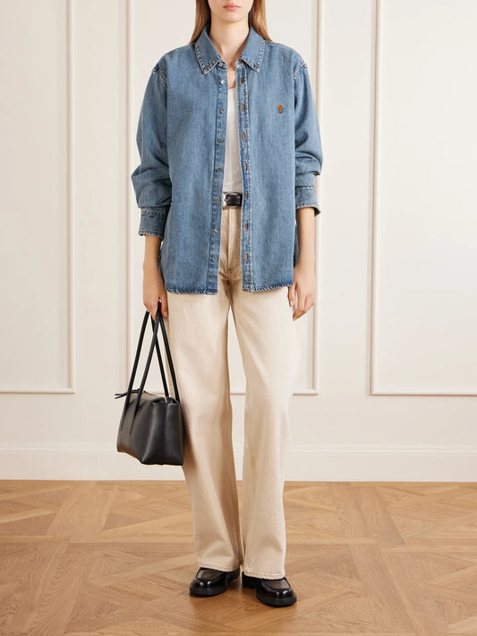 Image of a model wearing Tops. Product name - Logo-embroidered Denim Shirt in Mid denim colour by brand - AMI PARIS