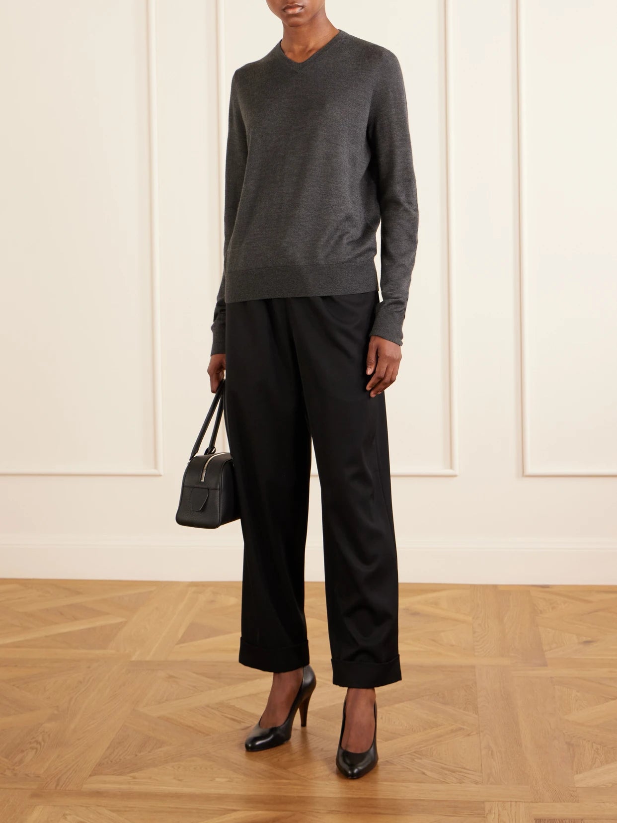 Image of a model wearing Outerwear. Product name - Ondre Cashmere And Silk-blend Sweater in Anthracite colour by brand - The Row