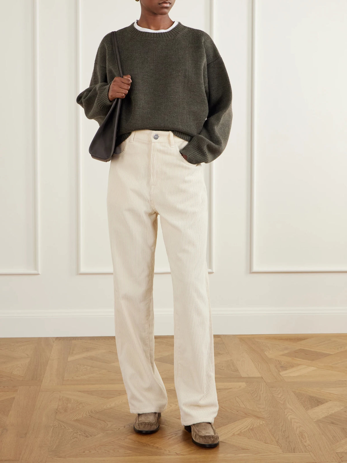Image of a model wearing Outerwear. Product name - Wool Sweater in Dark green colour by brand - RÓHE