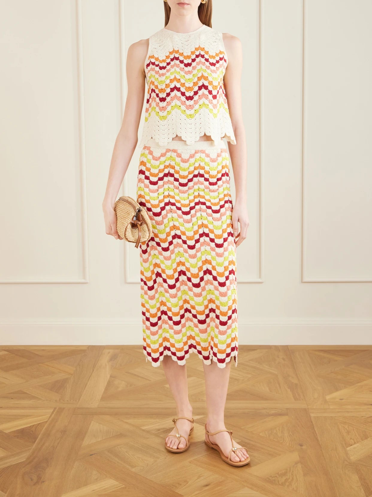 Image of a model wearing Skirts. Product name - Safi Crocheted Cotton Midi Skirt in Multi colour by brand - ESCVDO