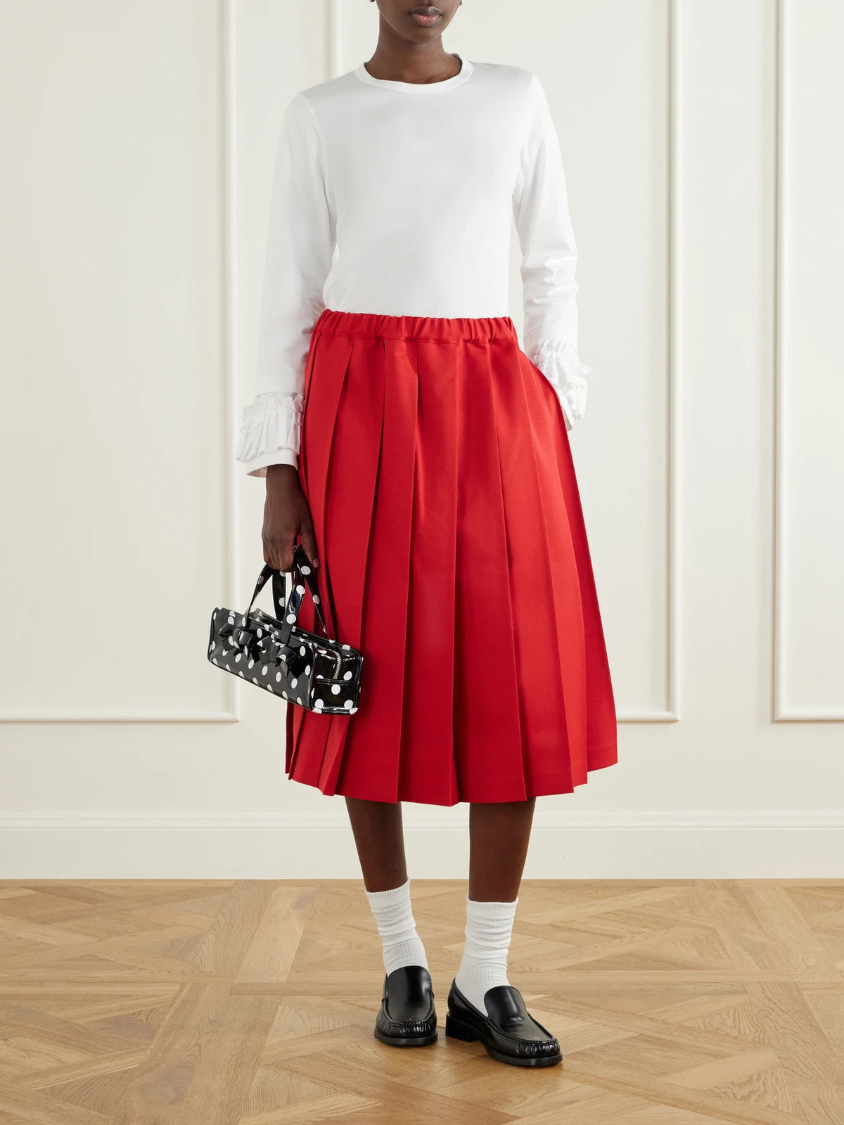 Image of a model wearing Tops. Product name - Ruffled Cotton-jersey T-shirt in White colour by brand - Comme des Garçons GIRL