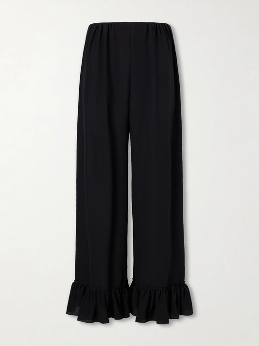Image of a model wearing Pants. Product name - Ruffled Silk Crepe De Chine Wide-leg Pants in Black colour by brand - Chloé