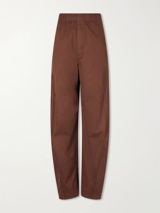 Image of a model wearing Pants. Product name - Garment-dyed Cotton-blend Gabardine Wide-leg Pants in Brown colour by brand - Tibi